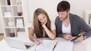 A couple looking to purchase home insurance and plan their finances