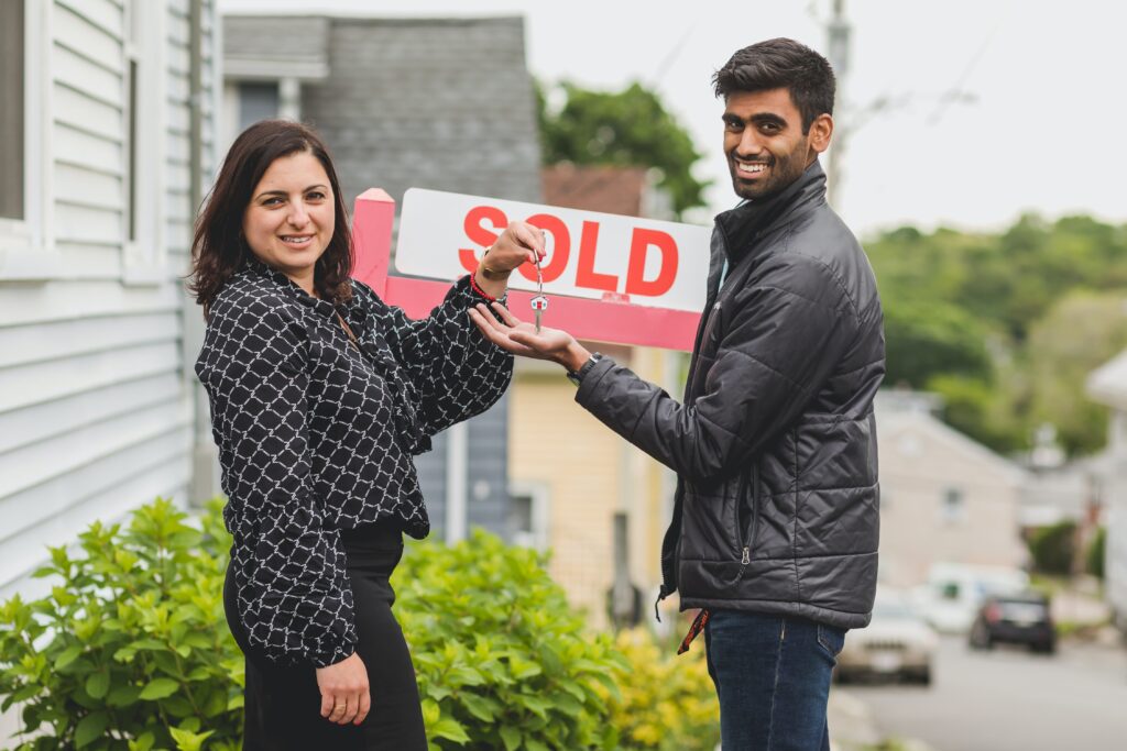 Happy couple getting their keys to their new home