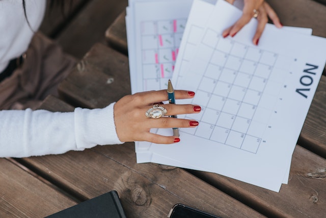 a woman creating a financial goals planner